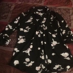 Two women’s blouses. Black and floral.